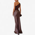 Women’s asymmetric maxi dress in brown with delicate pleats, flowing and elegant for weddings and formal events.1