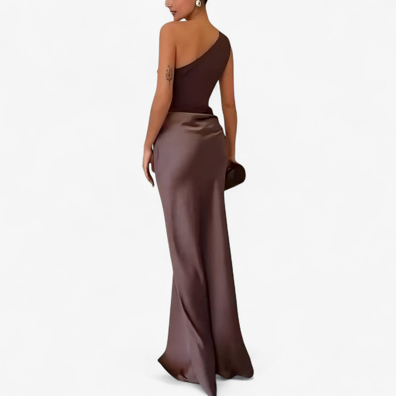 Women’s asymmetric maxi dress in brown with delicate pleats, flowing and elegant for weddings and formal events.1