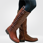 Women’s brown leather high boots with cosy lining and non-slip sole, durable and stylish for colder seasons.