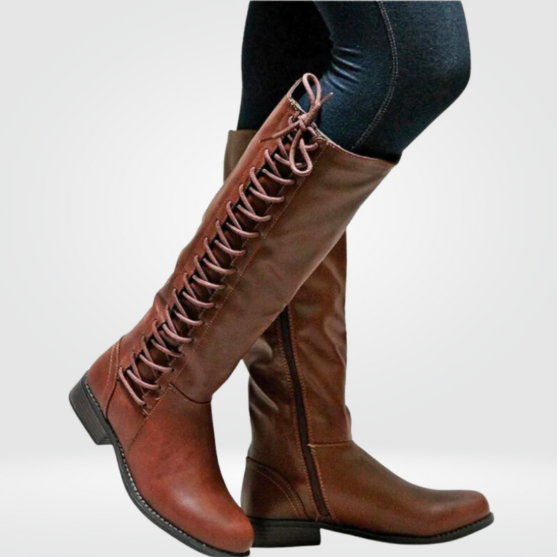 Women’s brown leather high boots with cosy lining and non-slip sole, durable and stylish for colder seasons.