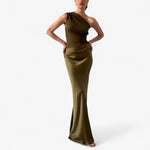 Women’s asymmetric maxi dress in dark green with delicate pleats, flowing and elegant for weddings and formal events.