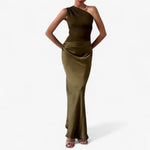 Women’s asymmetric maxi dress in dark green with delicate pleats, flowing and elegant for weddings and formal events.1