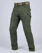Men’s outdoor pants in olive green with weather-resistant fabric, ergonomic design, and elastic cuffs for trekking, hiking, and climbing.