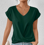 Women’s green tummy-tucking V-neck top with flattering fit and stretch fabric for elegant everyday wear.