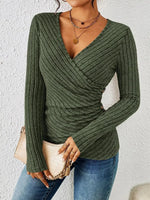 Women’s green tummy-tucking long sleeve V-neck top with elegant silhouette and comfortable stretch material.