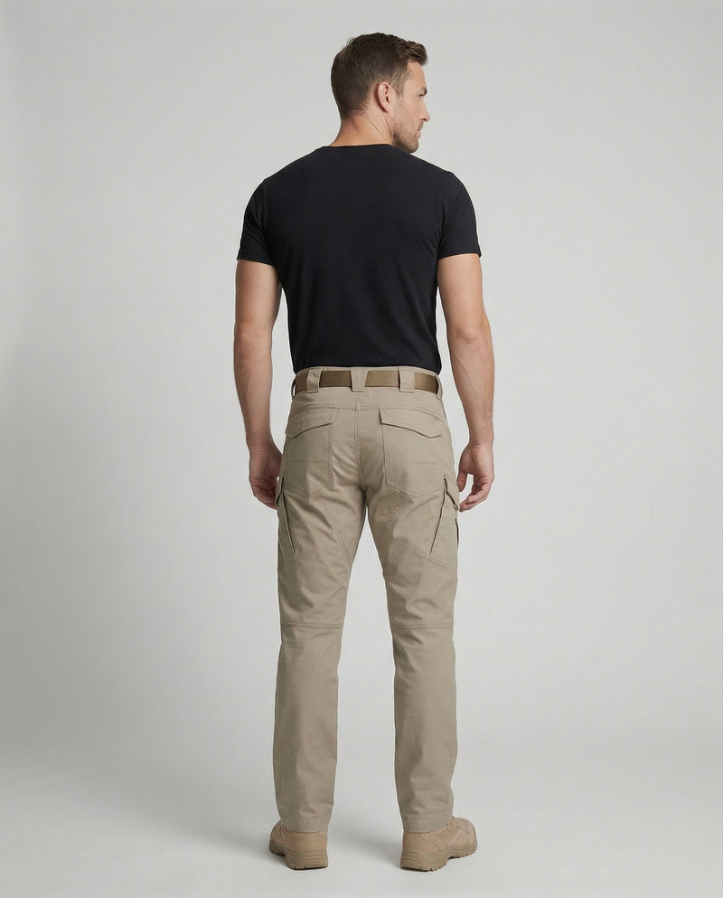 Men’s outdoor pants in khaki with weather-resistant fabric, ergonomic design, and elastic cuffs for trekking, hiking, and climbing.