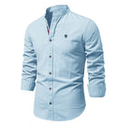 Men’s traditional shirt in light blue with classic button design, comfortable and stylish for smart casual and business wear.