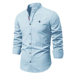 Men’s traditional shirt in light blue with classic button design, comfortable and stylish for smart casual and business wear.