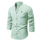 Men’s traditional shirt in light green with classic button design, comfortable and stylish for smart casual and business wear.