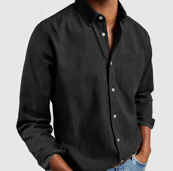Black button-up shirt worn by a person on a light gray background