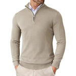Man wearing a beige half-zip sweater on a white background