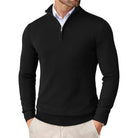 Black quarter-zip sweater worn by a person on a white background