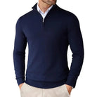 Navy blue quarter-zip sweater worn by a person on a white background
