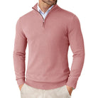 Pink sweater worn by a person on a white background