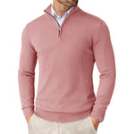 Pink sweater worn by a person on a white background