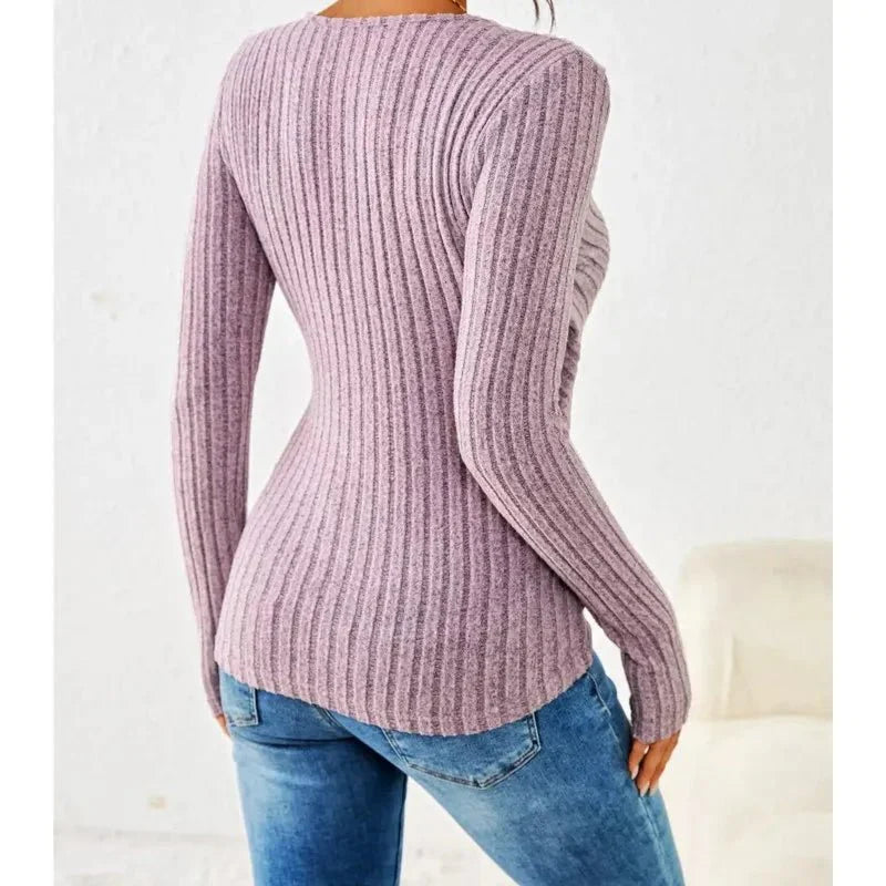 Women’s pink tummy-tucking long sleeve V-neck top with flattering fit and soft stretch fabric.