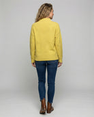 Women’s soft turtleneck sweater in yellow, warm and comfortable, stylish for casual and elegant winter outfits.