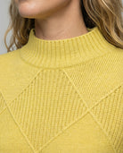 Women’s soft turtleneck sweater in yellow, warm and comfortable, stylish for casual and elegant winter outfits.