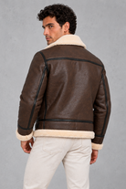 Men’s faux leather aviator jacket with a soft sherpa collar and lining, full zip front, contrast trim and relaxed silhouette.