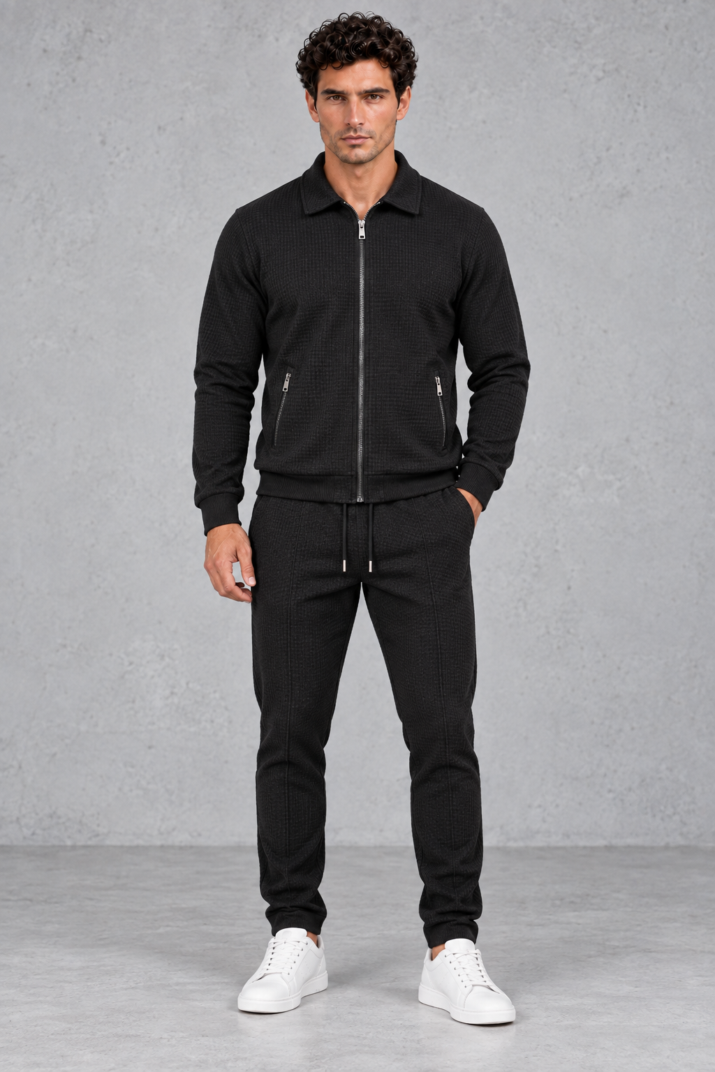 Men’s textured two-piece tracksuit with a full-zip collared jacket, ribbed trims and matching tapered drawstring joggers.