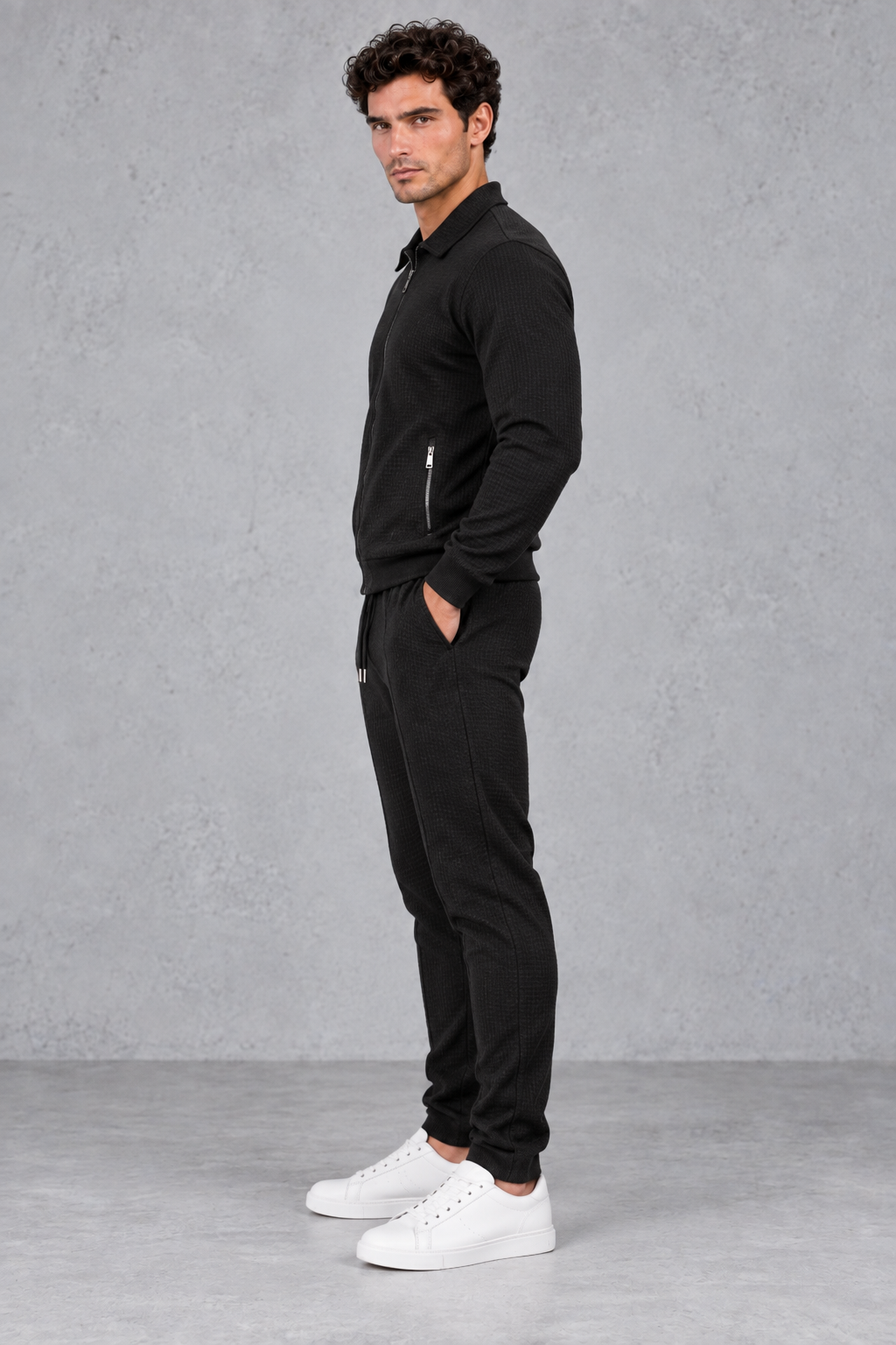 Men’s textured two-piece tracksuit with a full-zip collared jacket, ribbed trims and matching tapered drawstring joggers.