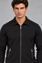 Men’s textured two-piece tracksuit with a full-zip collared jacket, ribbed trims and matching tapered drawstring joggers.
