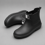 Women's waterproof ankle boots with a non-slip sole and easy pull-on design for comfortable everyday wear in wet weather.