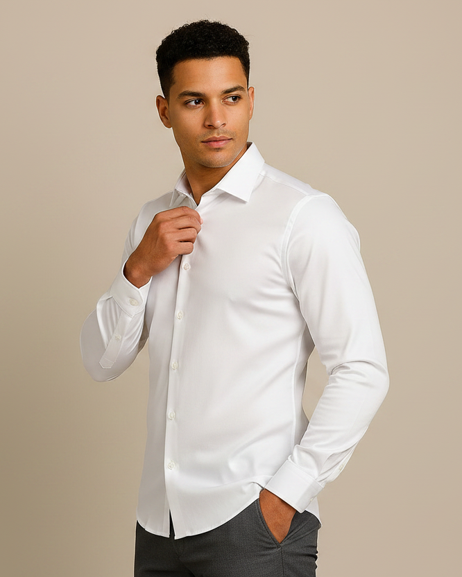 Man wearing a white dress shirt against a beige background