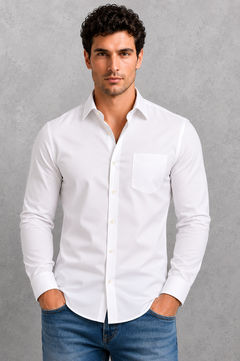 Man wearing a white dress shirt and blue jeans against a gray background