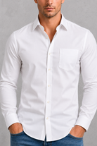 Man wearing a white dress shirt against a gray background