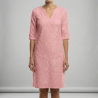 Pink dress with floral pattern on a gray background