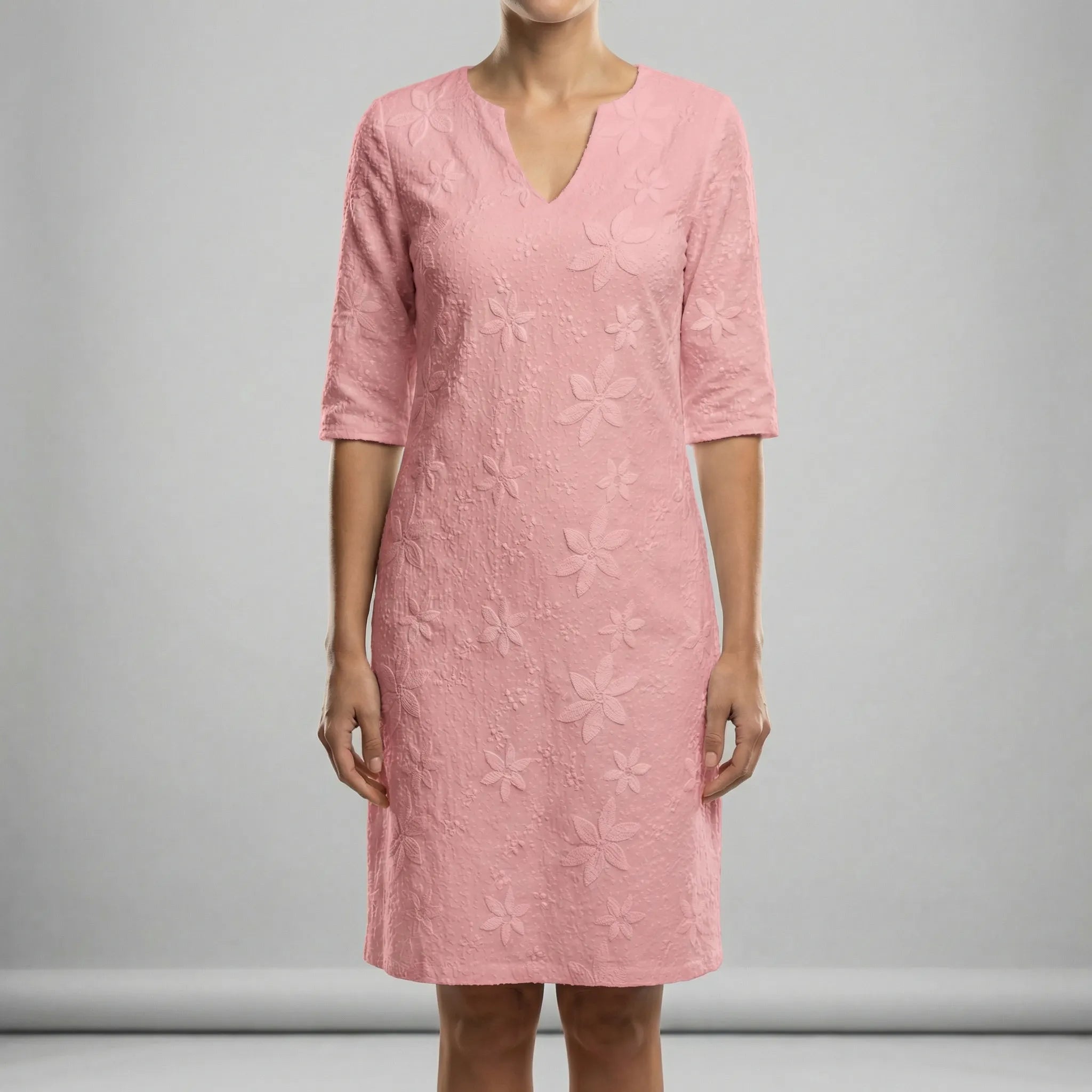 Pink dress with floral pattern on a gray background