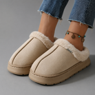 Women's fluffy winter slippers with a plush faux suede upper, soft fleece lining, thick non-slip EVA sole and slip-on design, providing warm, lightweight comfort for indoor wear during autumn and winter.