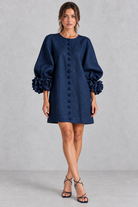 Women’s cotton-linen mini dress with 3D floral detailing, round neckline, long lantern sleeves and a loose A-line silhouette.