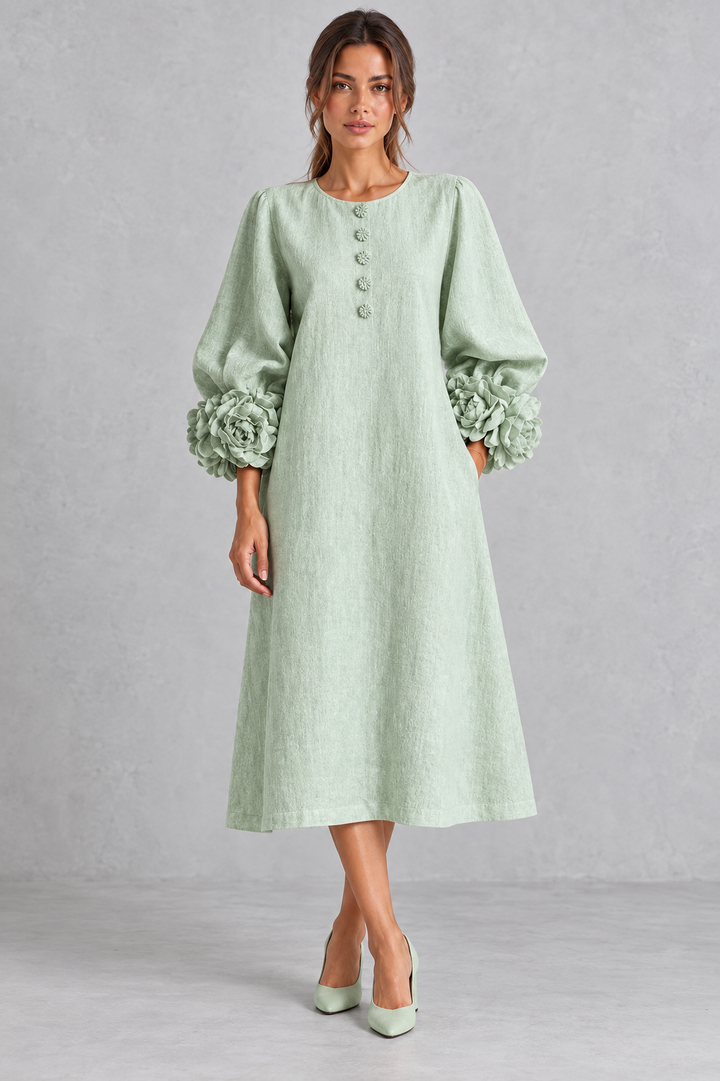 Women’s long dress with 3D floral detailing, round neckline, statement lantern sleeves, button accents and a loose A-line silhouette.