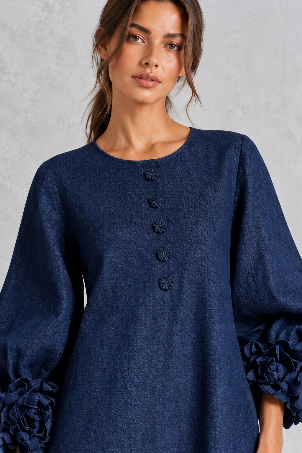 Women’s long dress with 3D floral detailing, round neckline, statement lantern sleeves, button accents and a loose A-line silhouette.
