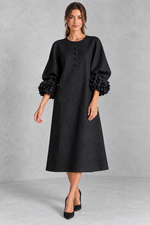 Women’s long dress with 3D floral detailing, round neckline, statement lantern sleeves, button accents and a loose A-line silhouette.