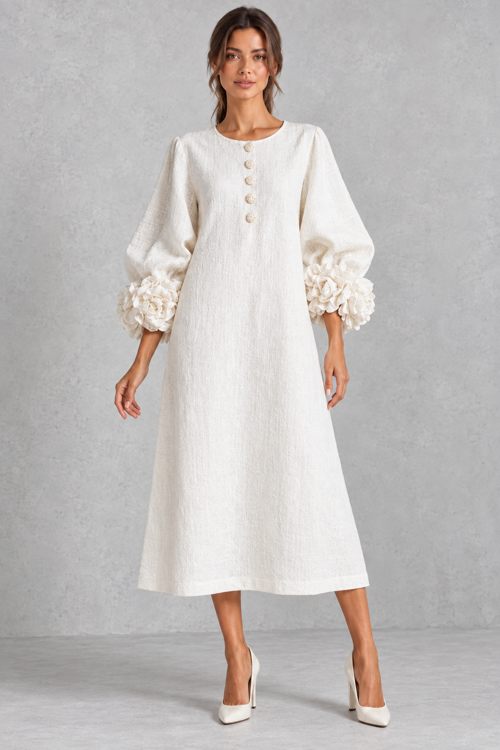Women’s long dress with 3D floral detailing, round neckline, statement lantern sleeves, button accents and a loose A-line silhouette.