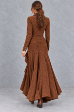 Women’s asymmetric A-line maxi dress with a classic lapel neckline, button detailing, long sleeves and a flowing statement hem.