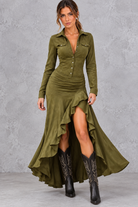 Women’s asymmetric A-line maxi dress with a classic lapel neckline, button detailing, long sleeves and a flowing statement hem.