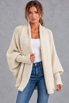 Women's batwing knitted cardigan in Cream – front view