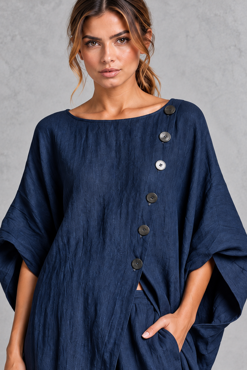 Women's navy blue batwing sleeve tunic – close-up of asymmetric button detail