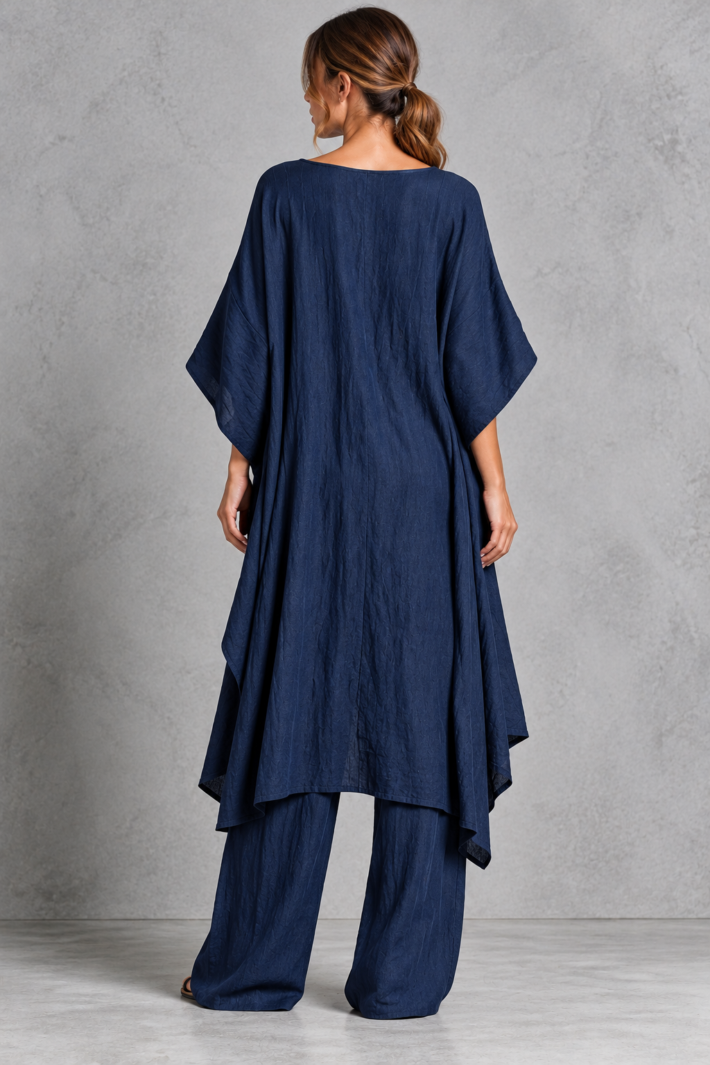Women's navy blue batwing sleeve tunic and wide leg trouser set – back view