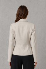 Women’s beige tailored blazer with single-button fastening, notched lapels, long sleeves and a fitted waist.