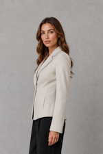 Women’s beige tailored blazer with single-button fastening, notched lapels, long sleeves and a fitted waist.
