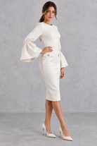 Women’s bodycon midi pencil dress with a classic round neckline, statement bell sleeves and a sleek fitted silhouette.