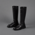 Women’s black faux leather mid-calf boots with pointed toes, low 3 cm heels and inside zip fastening.