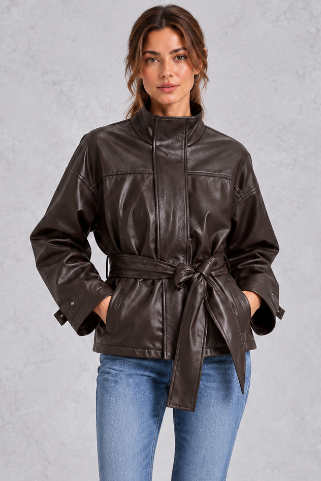 Women’s brown faux leather cropped jacket with a classic lapel collar, long sleeves and an adjustable belted waist.