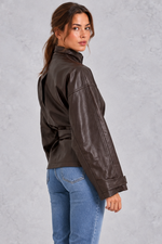 Women’s brown faux leather cropped jacket with a classic lapel collar, long sleeves and an adjustable belted waist.