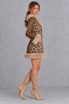 Women’s brown leopard print mini dress with a V-neckline, long sleeves, contrast faux fur detailing and a streamlined silhouette.